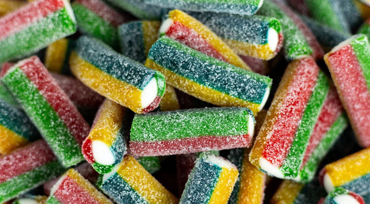 Brightly colored sour Rambo Bites candy displayed in a clear pouch