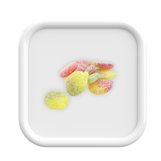 Colorful gummy candies on a white square plate