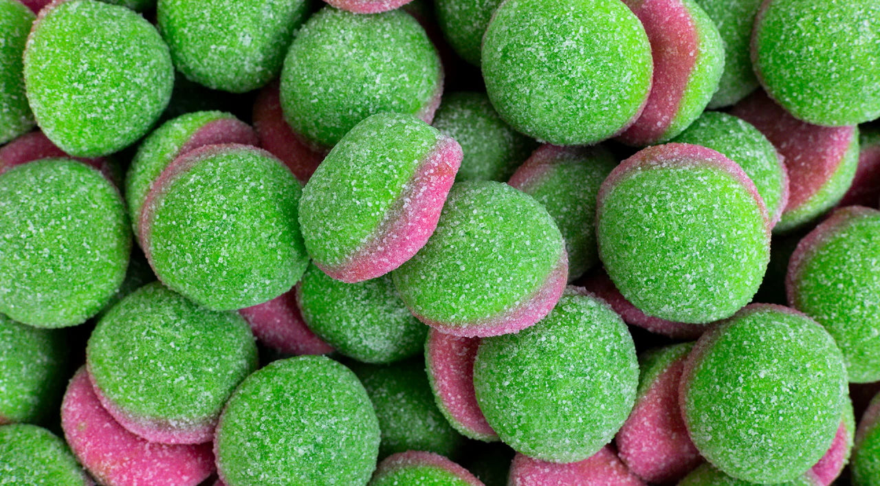 Close-up of green and pink gummy candies