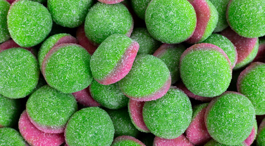 Close-up of green and pink gummy candies