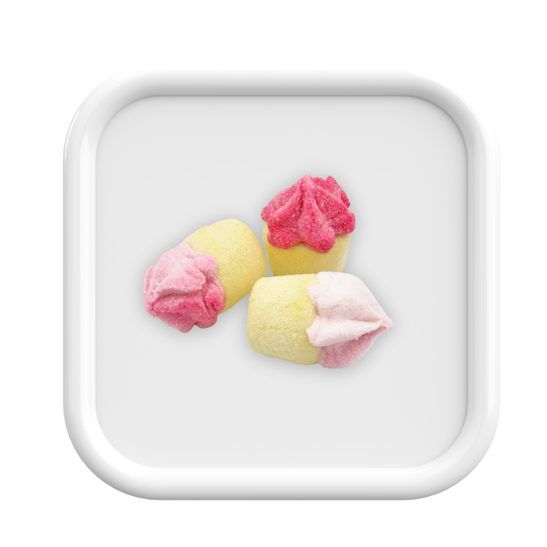 Three pink and yellow ice cream-like cookies on a white square plate.